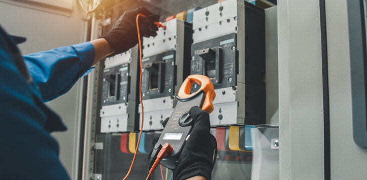 Electrical equipment maintenance service engineer Engineers carry AC voltmeters to check voltage at breaker terminals and inspect switchgear.