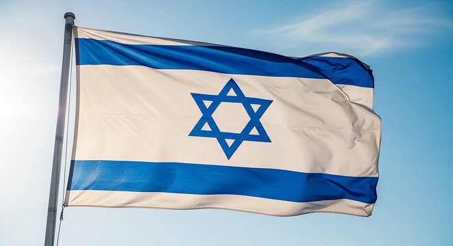 Israel flag waving against blue sky on flagpole