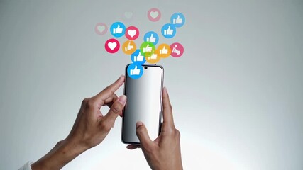 Hands holding a smartphone with colorful social media icons floating above, representing the concept of social media marketing, engagement, and online communication - Powered by Adobe