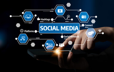 A captivating digital concept showcasing social media interaction with a hand holding a smartphone, surrounded by various social media icons and elements in a dark setting. Tessel