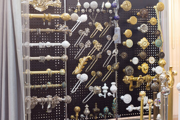 Variety of cornice for curtains in the shop © DmyTo