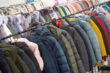 Winter jackets on a rack in a store