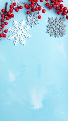 Festive Winter Border: Vibrant Red Berries and Sparkling Snowflakes on a Soft Blue Background
