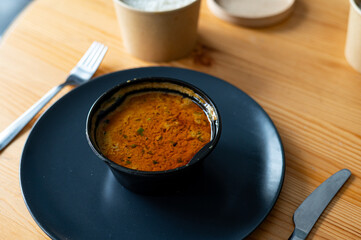 bowl of soup on wood background