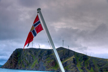 Norwegian fkag at windfarm on island near Haveysund, Norway