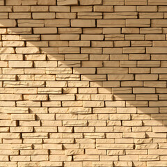 Fototapeta premium Modern beige stone brick wall texture for architecture and design