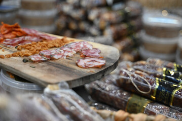 A meat board with a few different smoked sausages