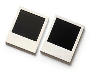 Two White Instant Photo Frames with Black Blank Screens on White Background image