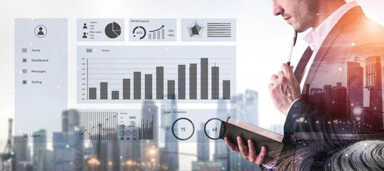 A businessman thoughtfully analyzes data displayed on a digital interface against a city backdrop, symbolizing modern analytics and performance management. Impute