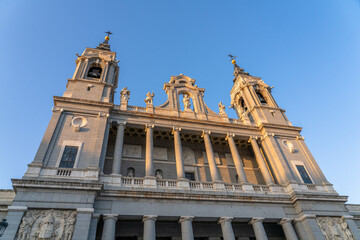 Obraz premium The Almudena Cathedral in Madrid Spain at Sunrise with Orange Glow on the Stone