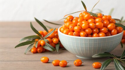 Sea buckthorn in bowl on wooden table