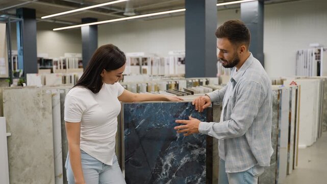 Couple choosing ceramic tiles for home renovation