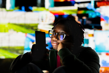 Woman holding smartphone close to face, glued to screen, showing signs of phone addiction. Person staring at mobile device, unable to look away from digital apps and notifications, procrastinating