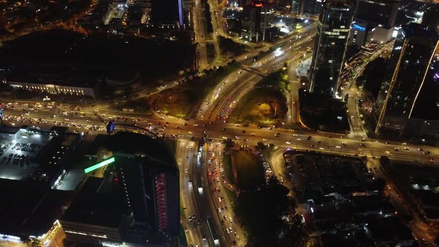 Aerial night view of the busy javier prado avenue intersection with heavy traffic in lima, peru
