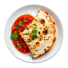 Overhead shot of a folded flatbread dish, filled, next to a pool of vibrant red sauce