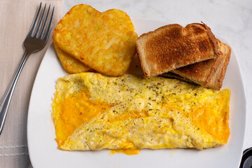 cheese omelette with  hash browns, and toast