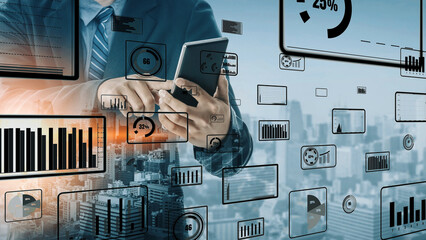 A business professional engages with a smartphone amidst a visually dynamic display of data metrics and graphs, showcasing modern analytics in an urban environment. Xenic