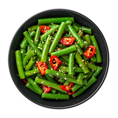 A top-down view of a black bowl filled with cooked green beans, red peppers, and seeds