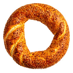 Close-up of a golden-brown, ring-shaped bread covered in sesame seeds against black