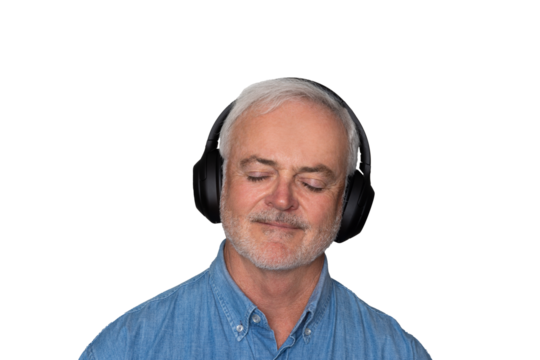 Close up portrait of handsome Mature man listening to music with headphones against a transparent background.