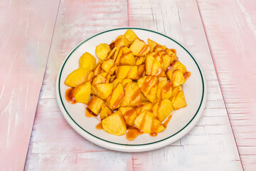 Homemade fries cut into thick sticks, temperature-controlled fried, and sprinkled with fresh parsley