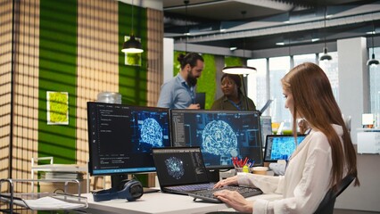 Junior developer in office integrating AI machine learning systems to streamline workflows. Young employee uses neural networks artificial intelligence, technology overload concept, camera A