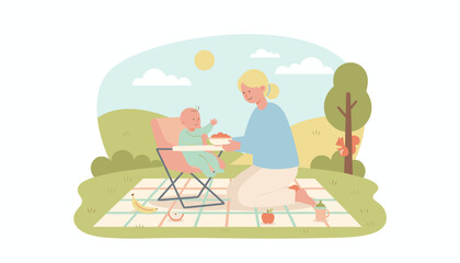 Happy mother feeding baby solid food outdoors Family picnic nurture care healthy lifestyle