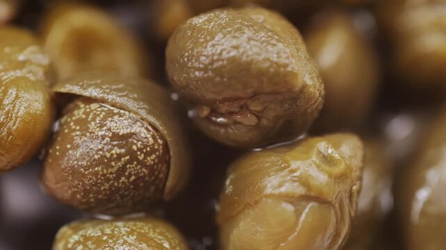 Pickled capers spanish food. Marinated buds of caper bush. Mediterranean cuisine ingredient. Organic spices and seasonings for meat, fish and vegetables, macro shot. Top view.