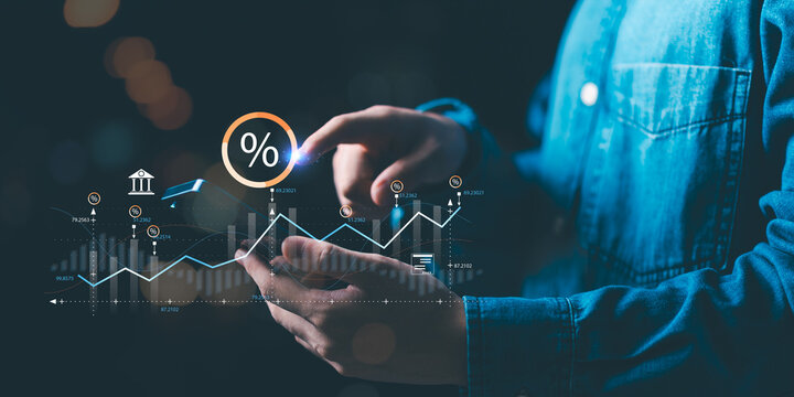 A businessman analyzes interest rate and financial growth using digital data visualization. Concept of finance, investment, profit, and market performance for banking, stock, and economic management. - Powered by Adobe