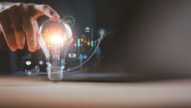 Creative idea in finance innovation with glowing light bulb and digital stock chart showing interest rate growth and market analysis. Concept of fintech, investment, economy, and business success. - Powered by Adobe