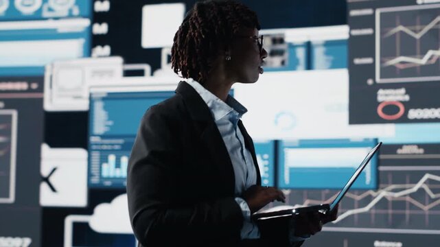 Manager evaluating business market graphs using laptop software, doing brainstorming. Businesswoman analyzing financial reports and data charts on notebook program for business insights, camera B