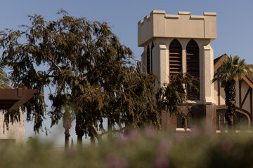 Beautiful trees frame a historic church in downtown Corona, California, USA.