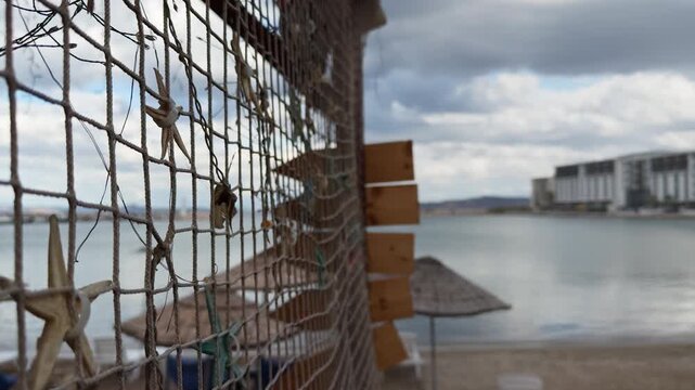 Dry Starfish on a Fishing Nets near the Seaside Beach