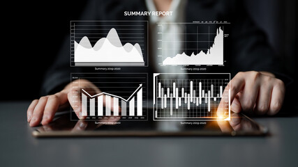A businesswoman examines detailed charts on a tablet device, showcasing data analysis from a summary report within a modern office setting. Impute