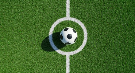 Overhead shot of a soccer ball on a field with white lines and artificial green turf.