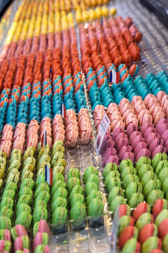 France, Paris. Brightly colored macarons at a bakery.