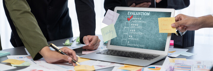 Analyst team use sticky note for creative and analytic brainstorm for business idea with BI data dashboard on laptop screen. Analysis financial data visualization tech for marketing strategy. Prodigy