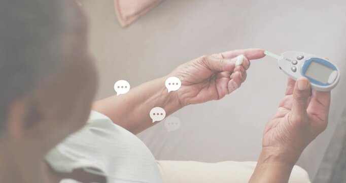 Senior woman positioning finger on glucometer creating chat bubbles for glucose data peaking fading