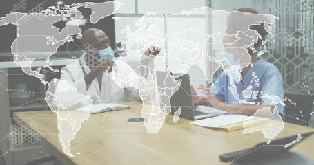 Nurse pointing at laptop and launching world map with network overlay for health data analysis - Powered by Adobe