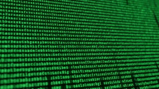 Macro view of a computer monitor with glowing green code, representing the abstract concept of big data, cybersecurity, and digital information