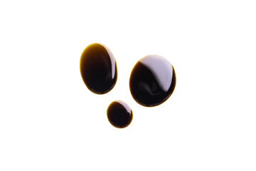 Old engine oil stains are separated on a transparent surface.