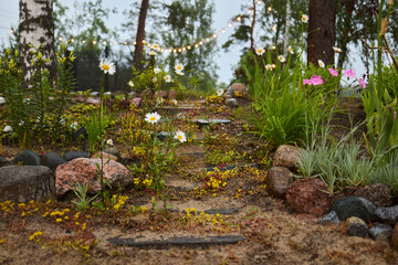 A Serene Garden Pathway with Beautiful Flowers and Stones for a Calm Environment