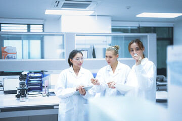 Researchers in a state of the art R and D institute discuss their findings. The facility's...
