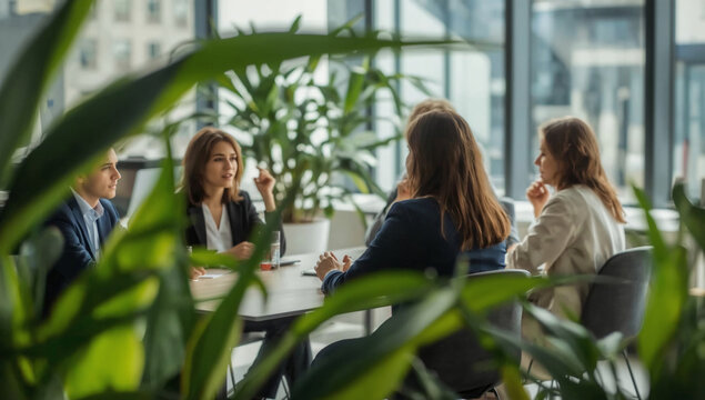 Confident meeting working with diverse team in office briefing. Mixed race business leader focused on meeting, collaborating and discussing business ideas with colleagues in meeting. - Powered by Adobe