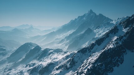 Obraz premium Majestic Snowy Mountain Range Under a Clear Blue Sky, Atmospheric Landscape.