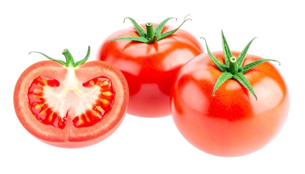 Three fresh tomatoes, one halved, against white