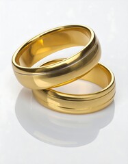 Two gold wedding rings, reflecting light