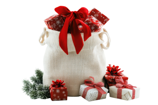 Festive christmas presents overflowing from a knitted sack with red ribbons and a small christmas tree on transparent background