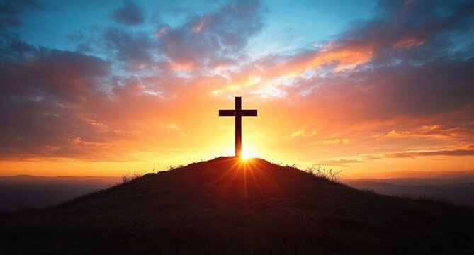 Silhouette of a cross on a hill with a bright sunrise and colorful sky filled with clouds creating a peaceful and spiritual atmosphere