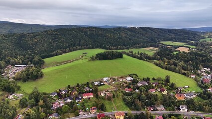 A Stunning Scenic Aerial View of a Lush Green Landscape and a Serene Residential Area